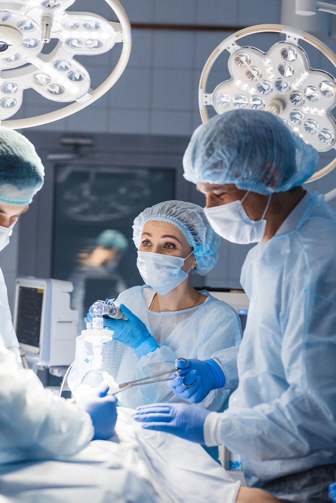 Diverse Team of surgeon, assistants and nurses making invasive surgery
